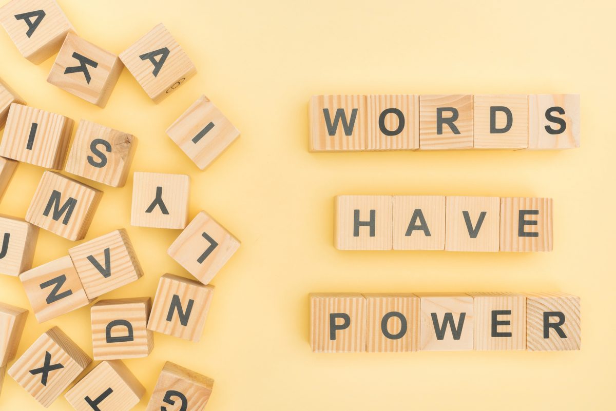 words have power spelled out in scrabble tiles