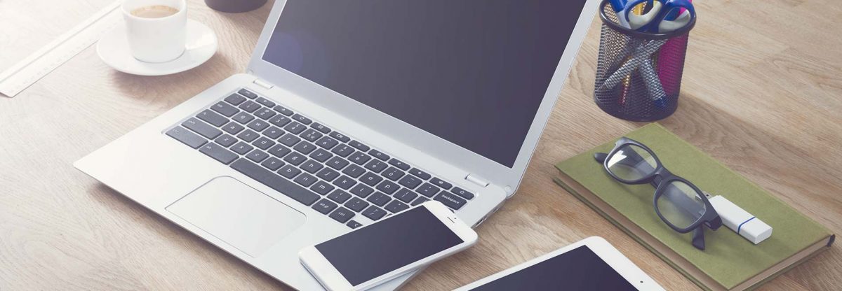 blank tablet phone and laptop on a desk, website design